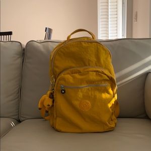 Yellow Kipling backpack.